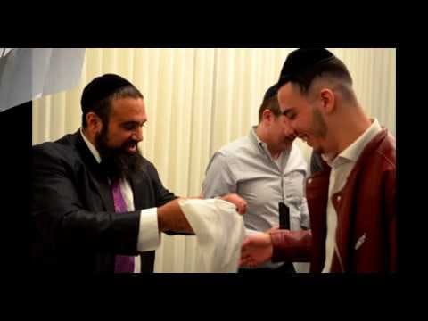 Rav Efraim and Rav Yaron giving out tzitzit around the world